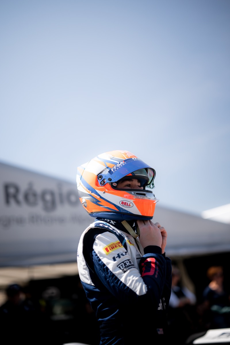 Jack Iliffe in paddock adjusting race equipment